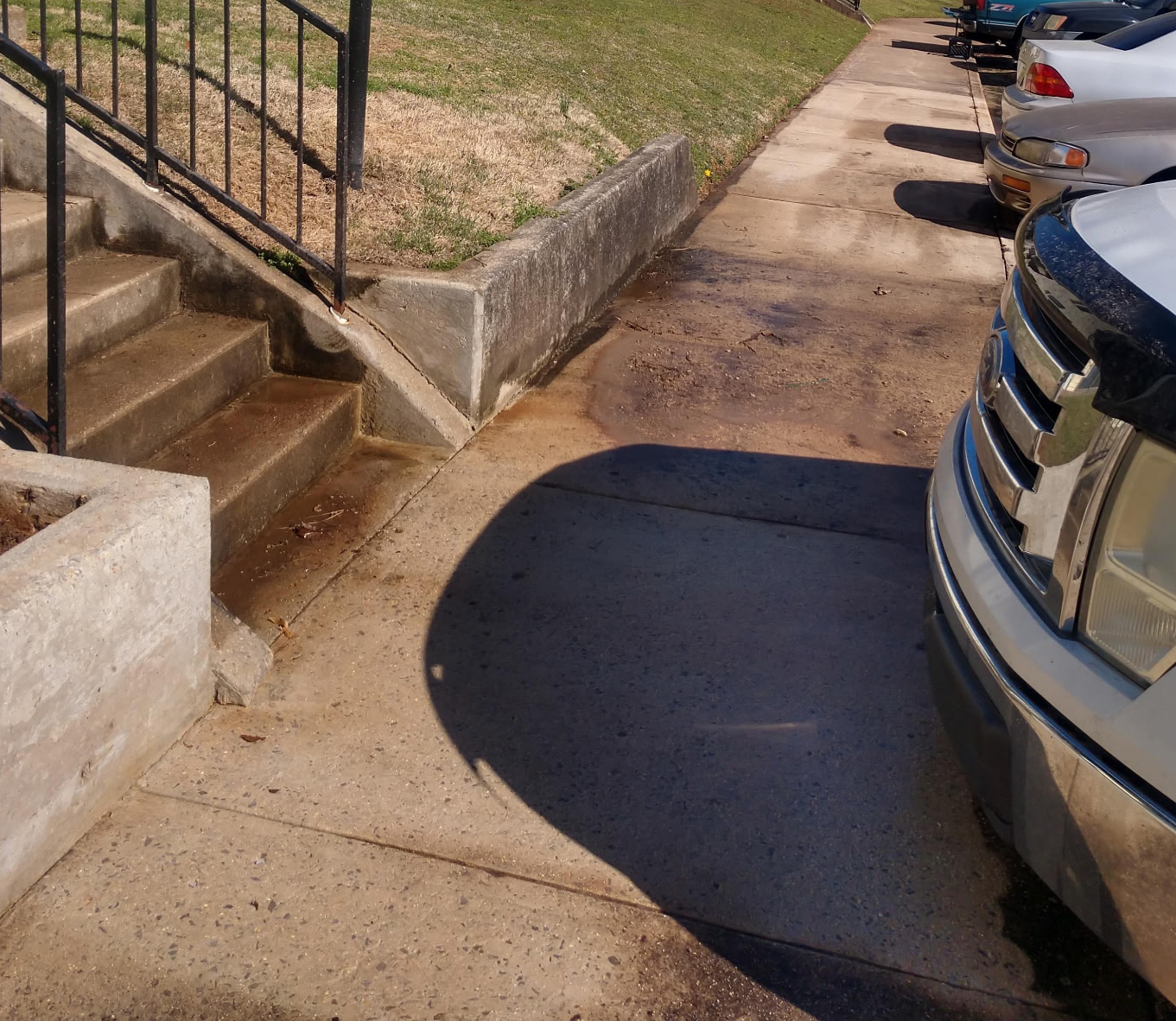 Before and after Driveway & Concrete Cleaning